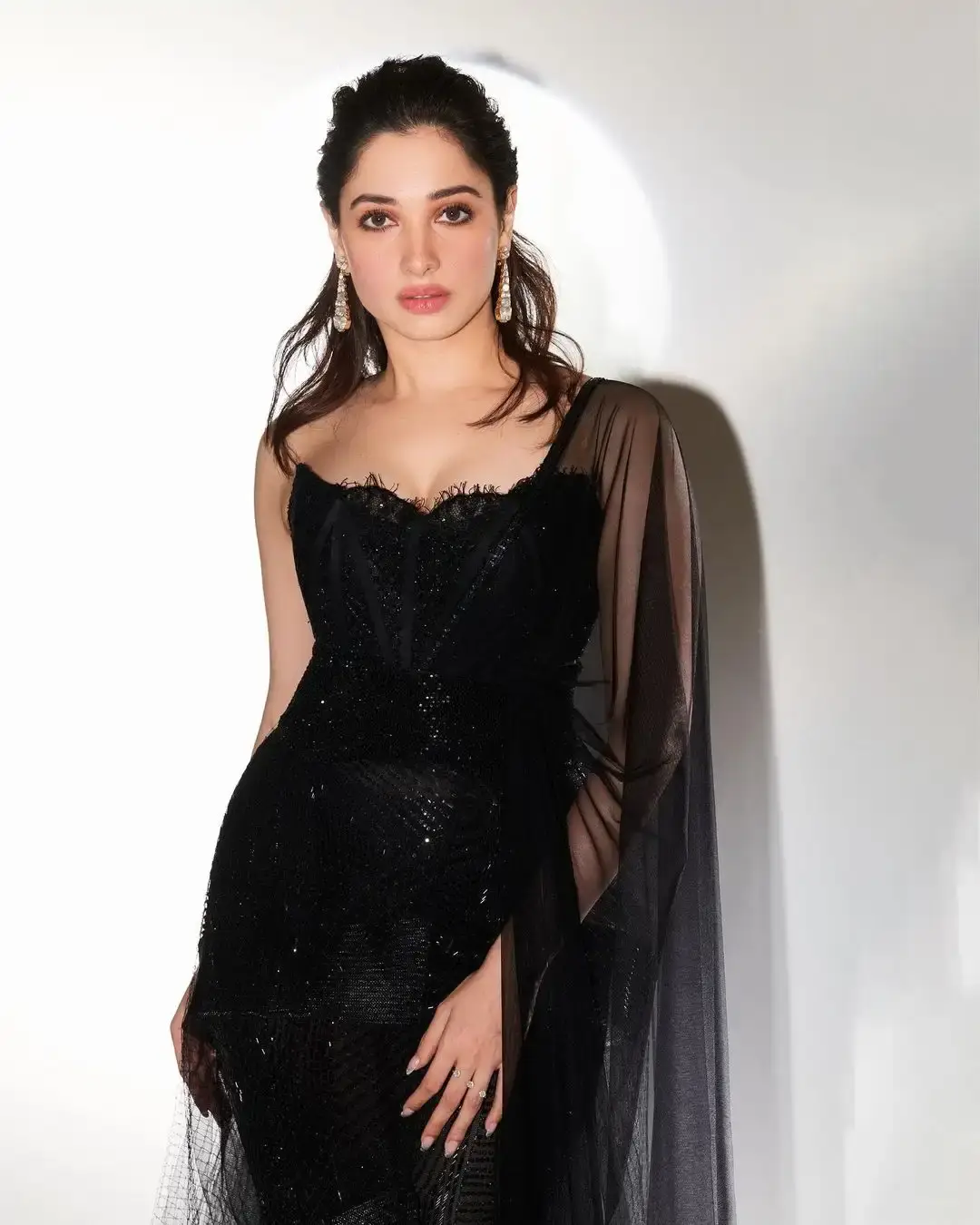 TAMANNAAH BHATIA STUNNING LOOKS IN LONG SLEEVELESS BLACK GOWN 2